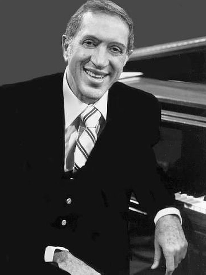 Johnny Costa seated at the piano