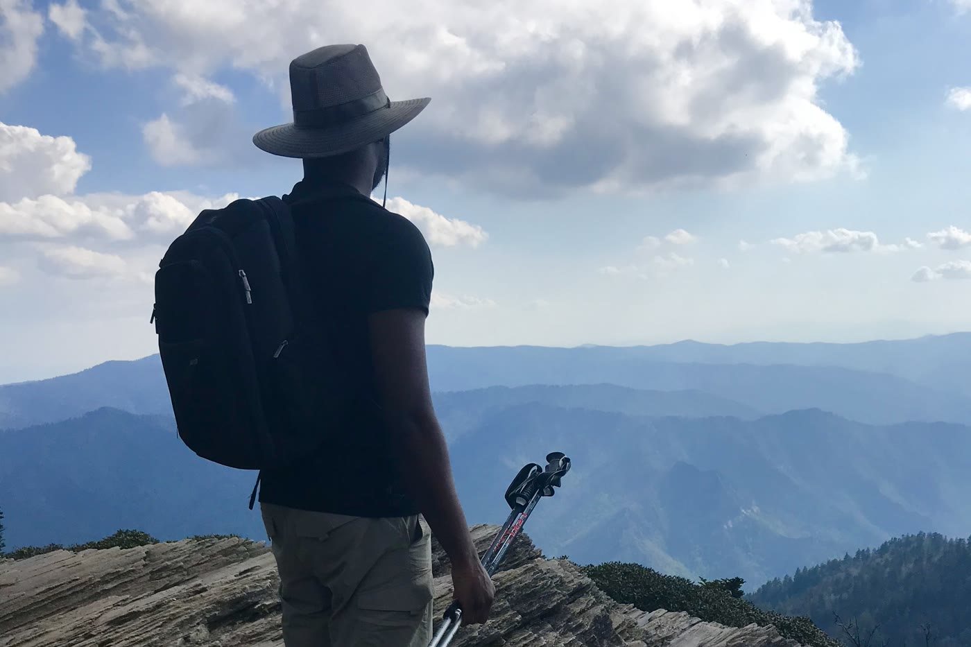 Michael Olaiya on a ridge in the Great Smoky Mountains, looking out over the range